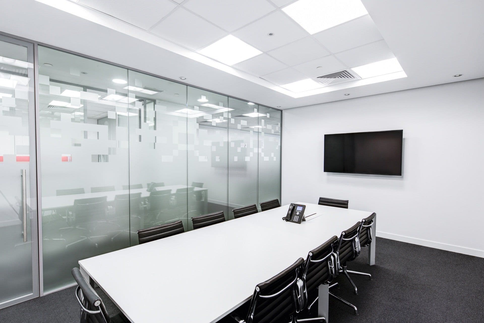 Remodeled conference room with glass partition walls